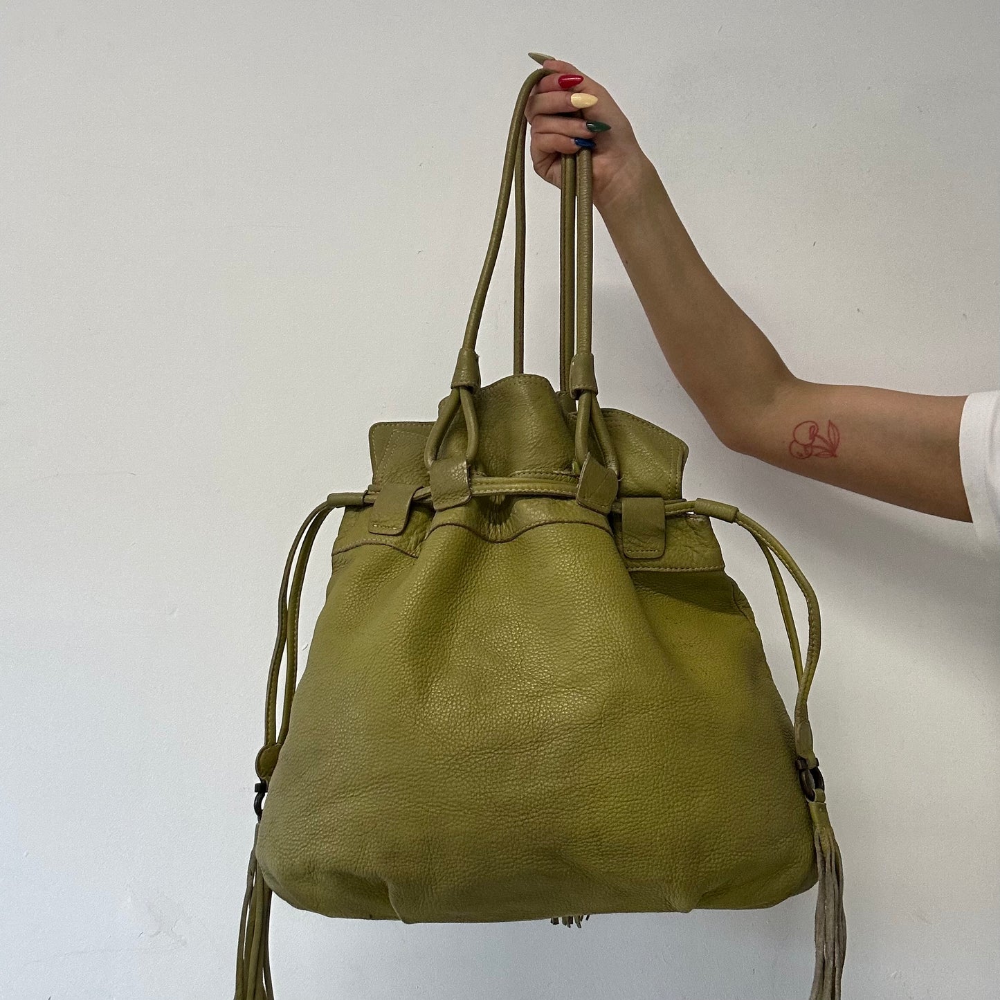 green leather double zip drawstring tote bag