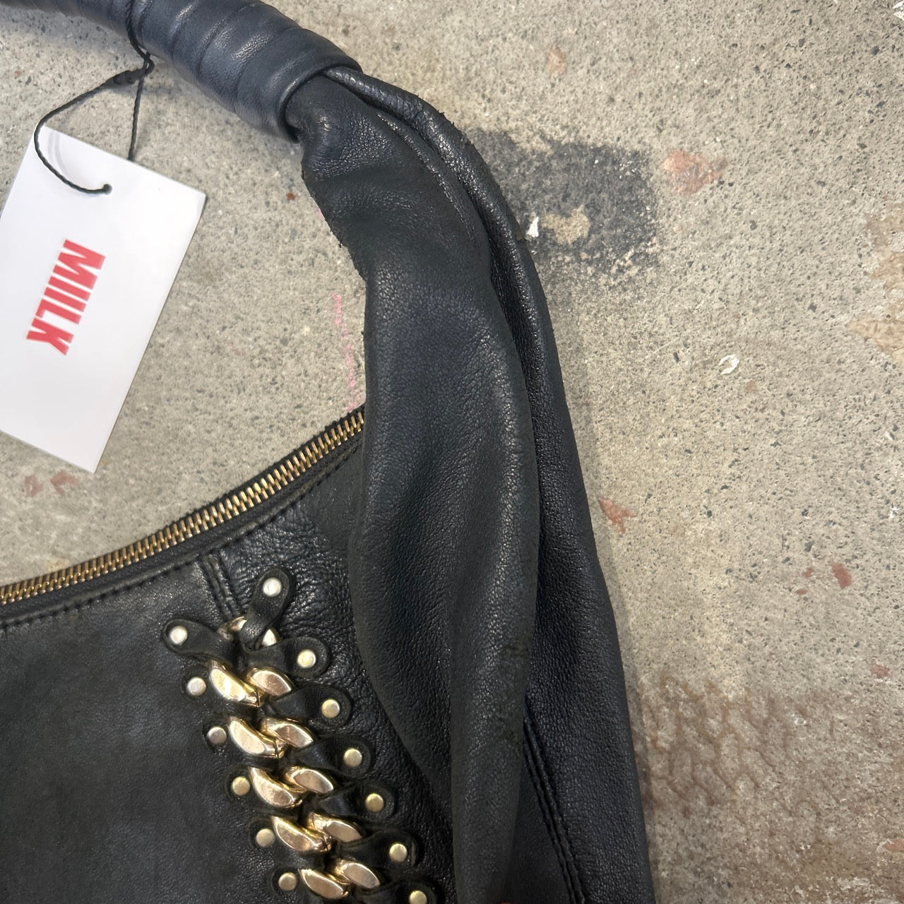 black genuine leather studded half crescent shoulder bag