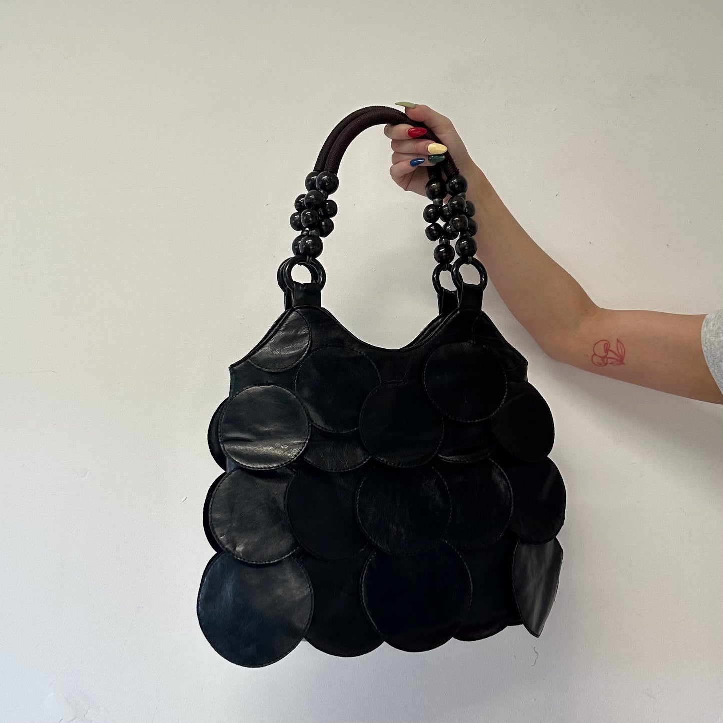black faux leather disc beaded shoulder bag