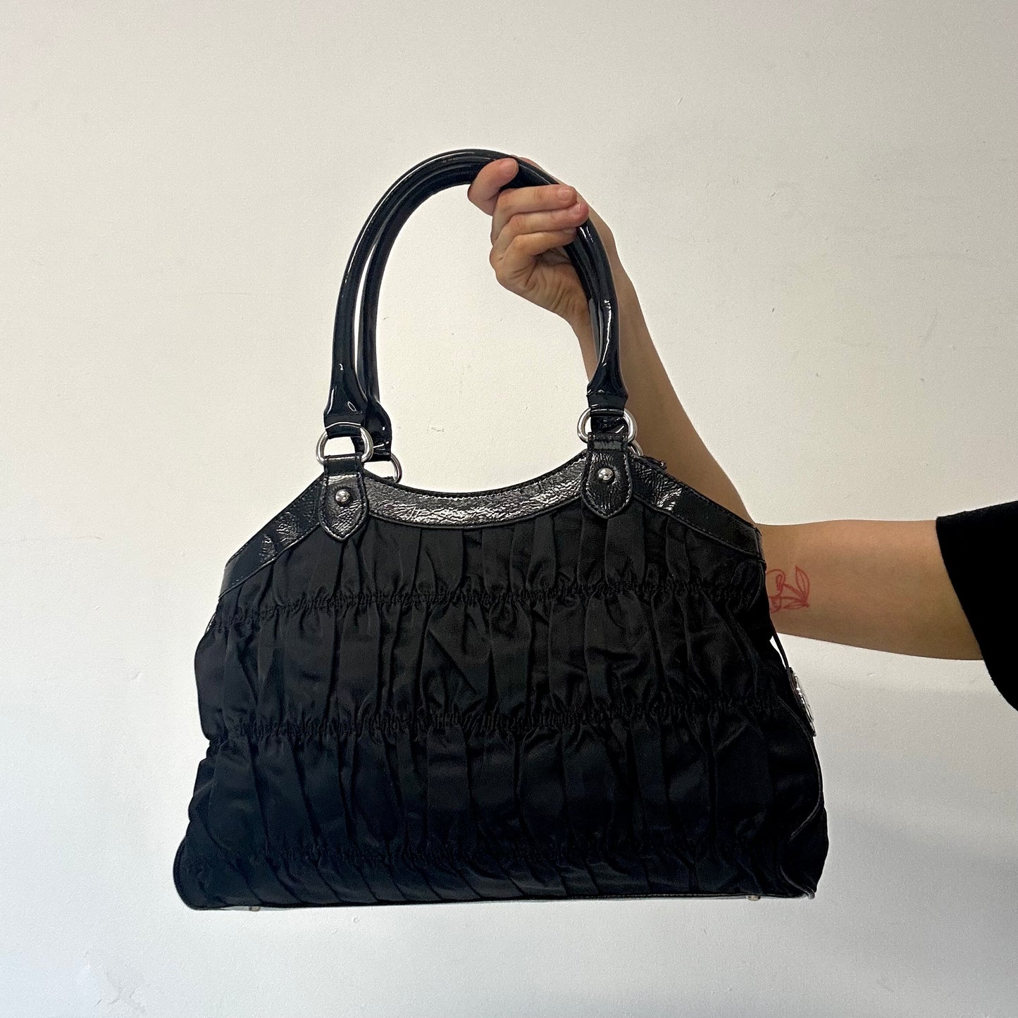 black ruched canvas and faux leather shoulder bag