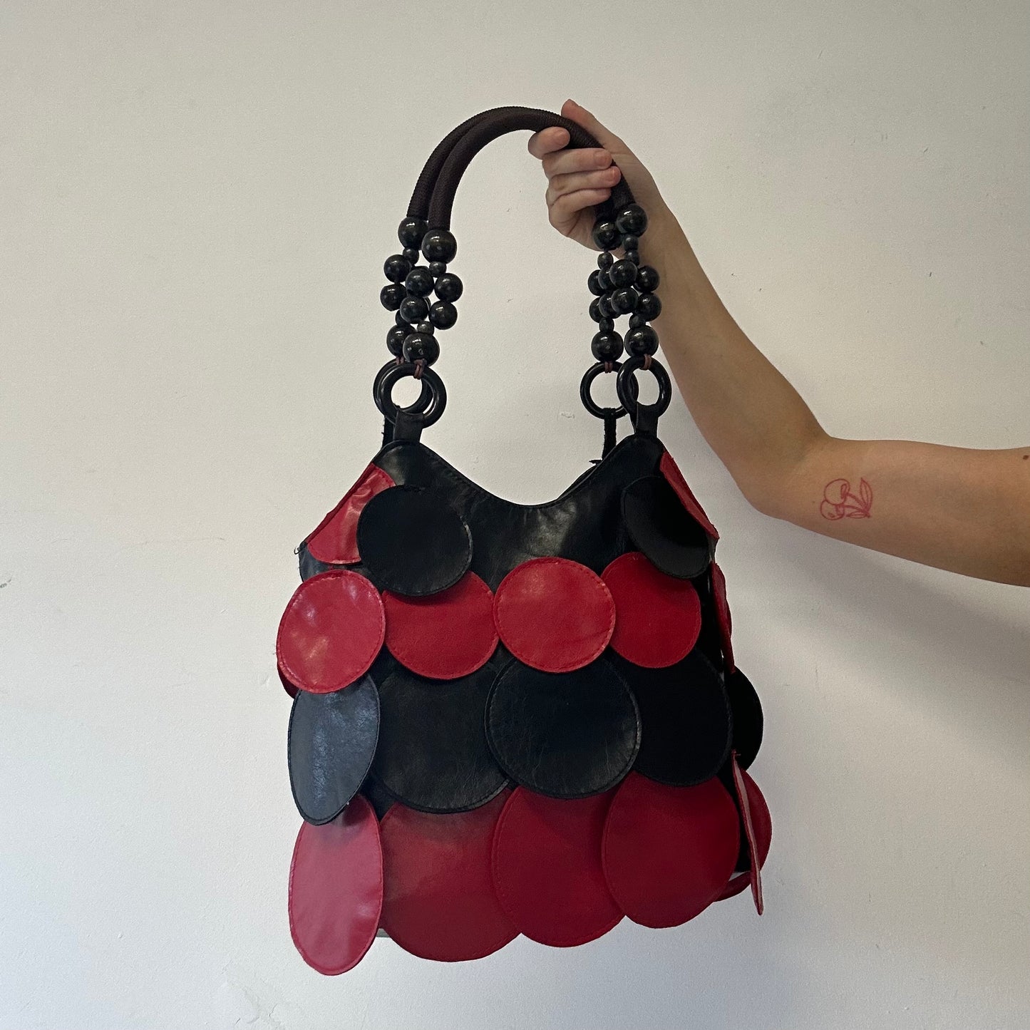 black and red faux leather disc beaded shoulder bag