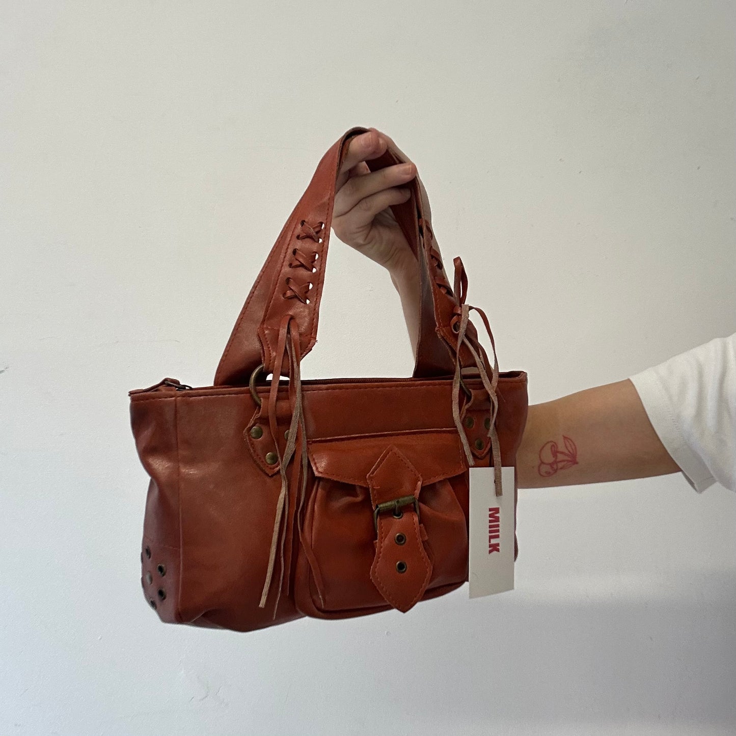 burnt orange / brown leather buckle shoulder bag