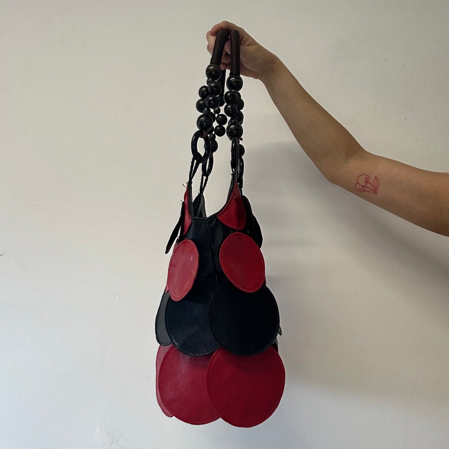 black and red faux leather disc beaded shoulder bag