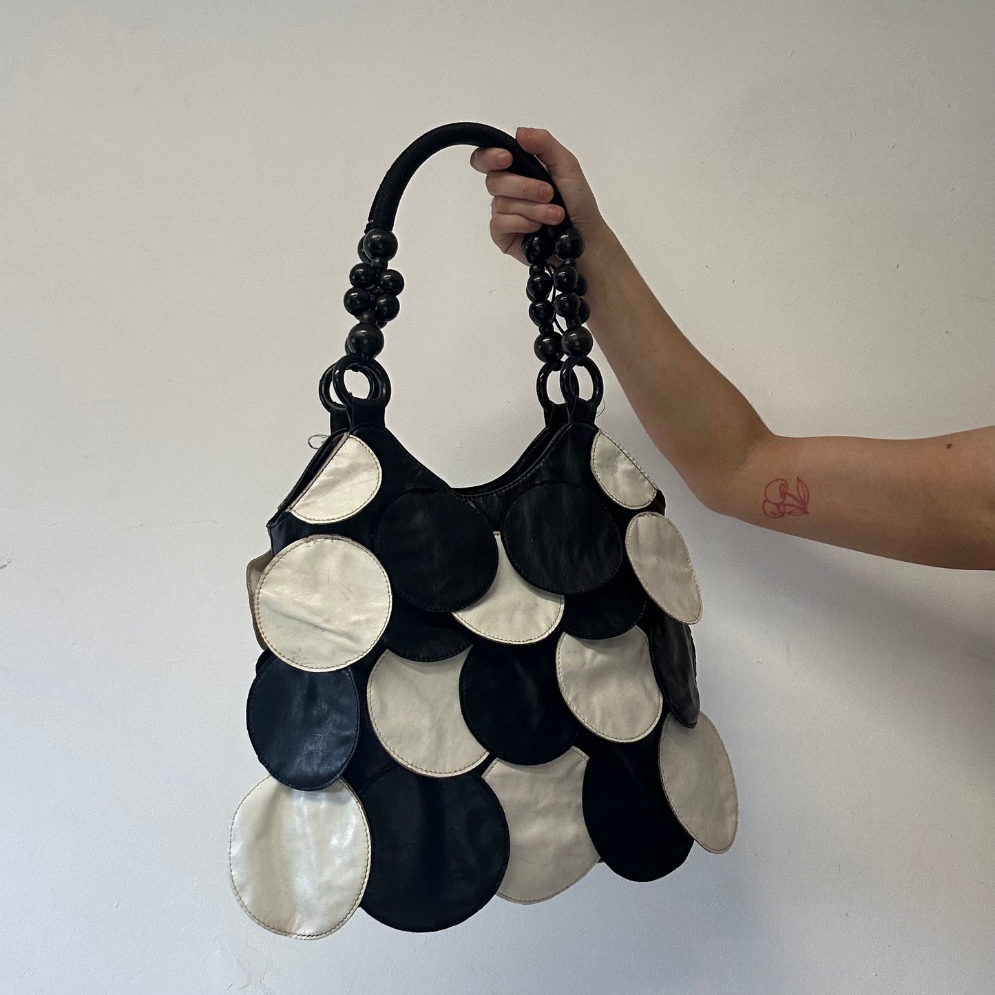 black and white faux leather disc beaded shoulder bag