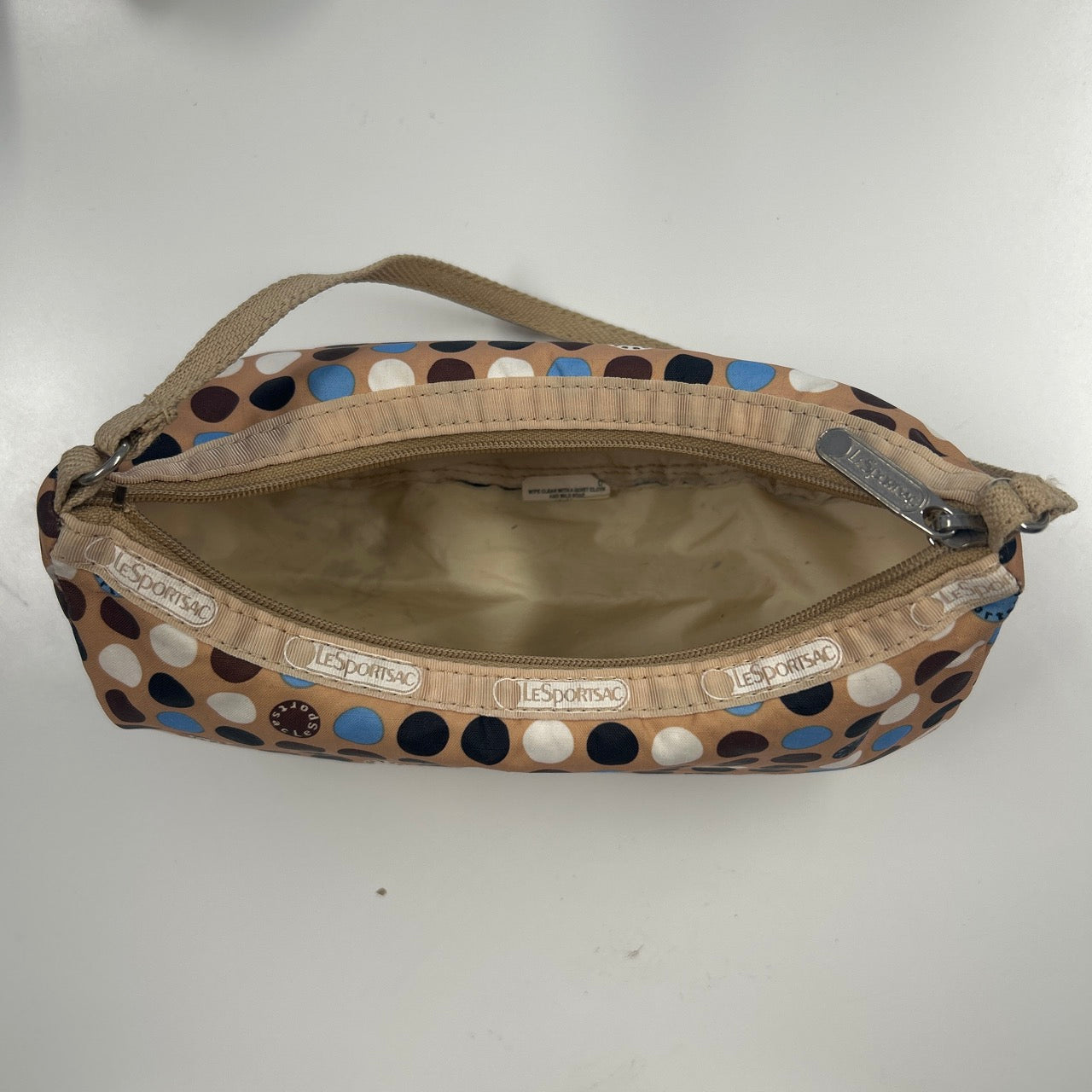 tanned blue polka dot canvas mini shoulder bag