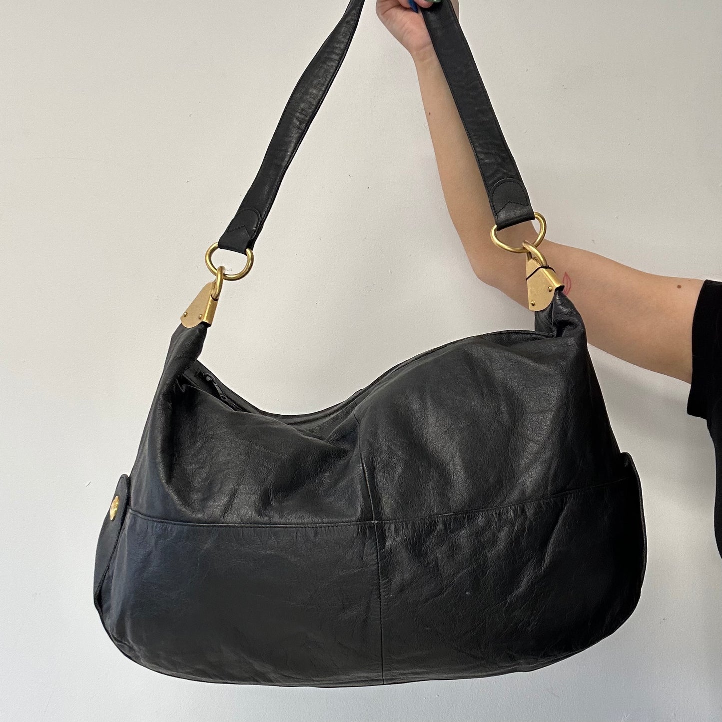 black faux leather large sling bag