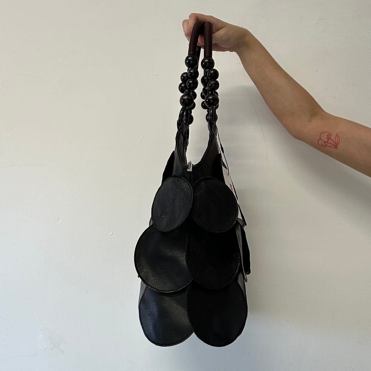 black faux leather disc beaded shoulder bag