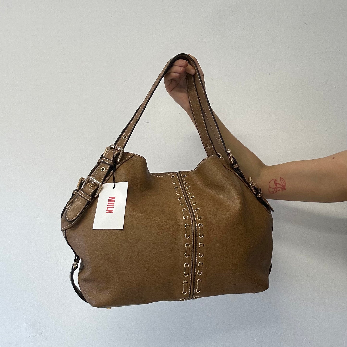 brown eyelet faux leather shoulder bag
