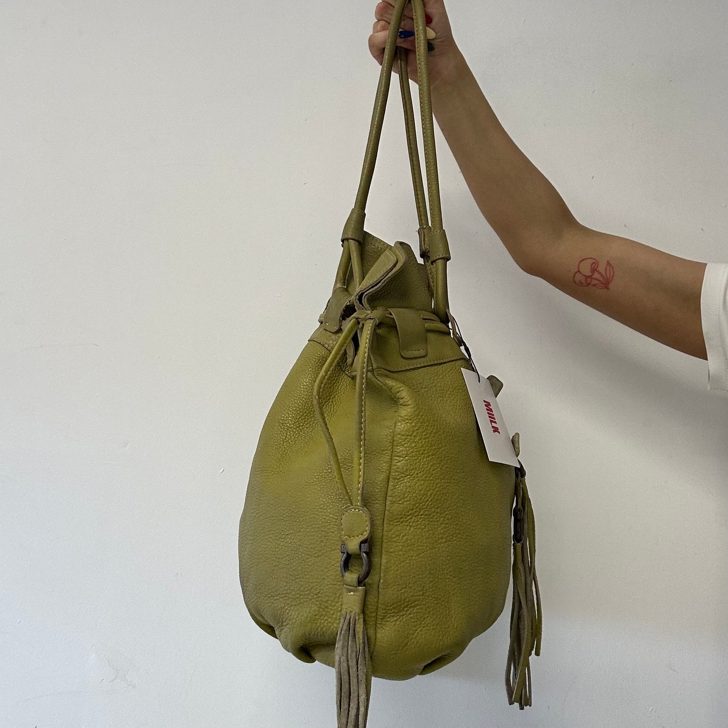 green leather double zip drawstring tote bag