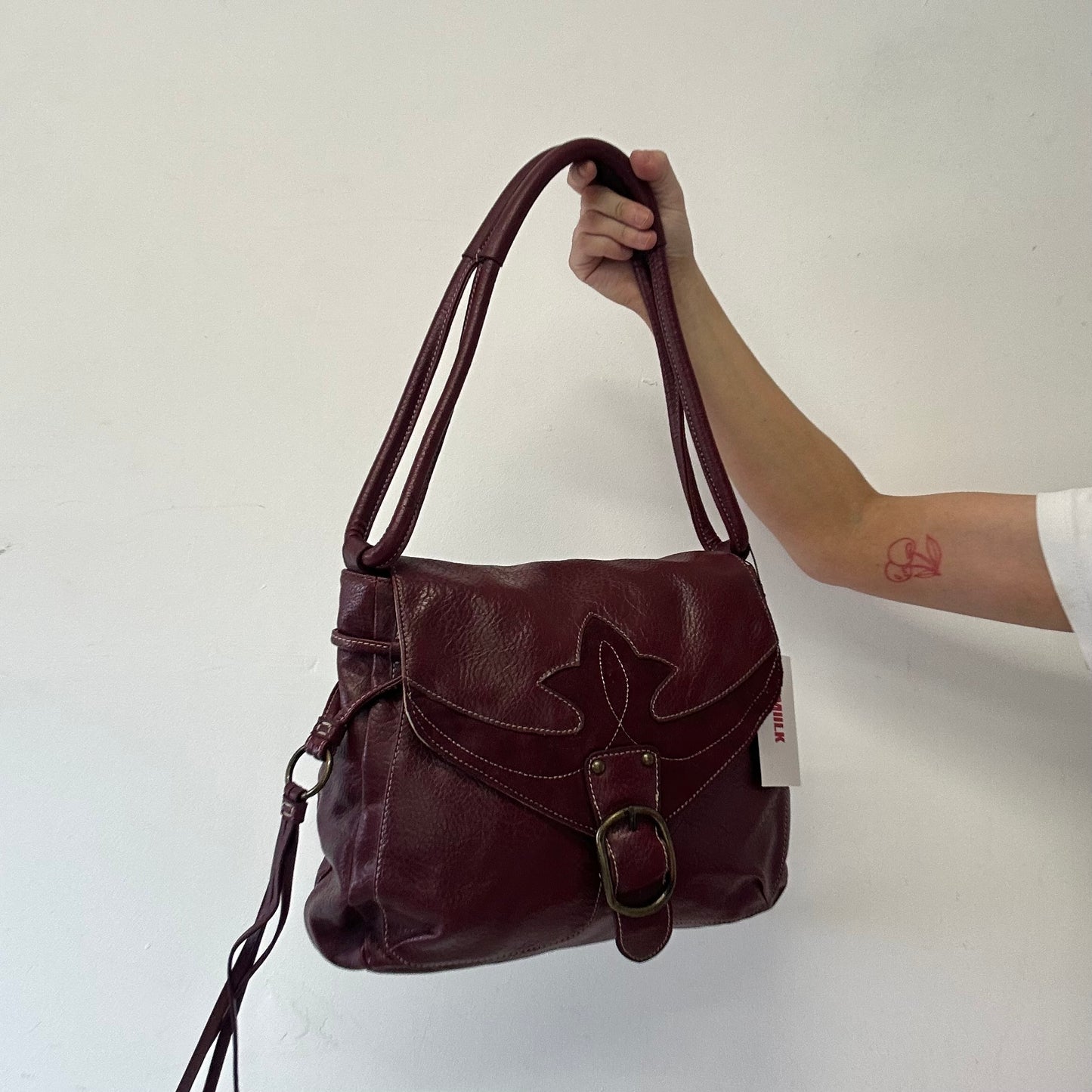dark red faux leather western buckle shoulder bag