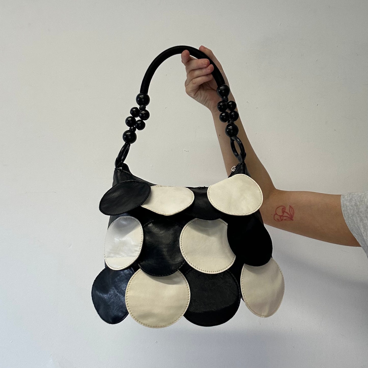 black and white faux leather disc beaded shoulder bag