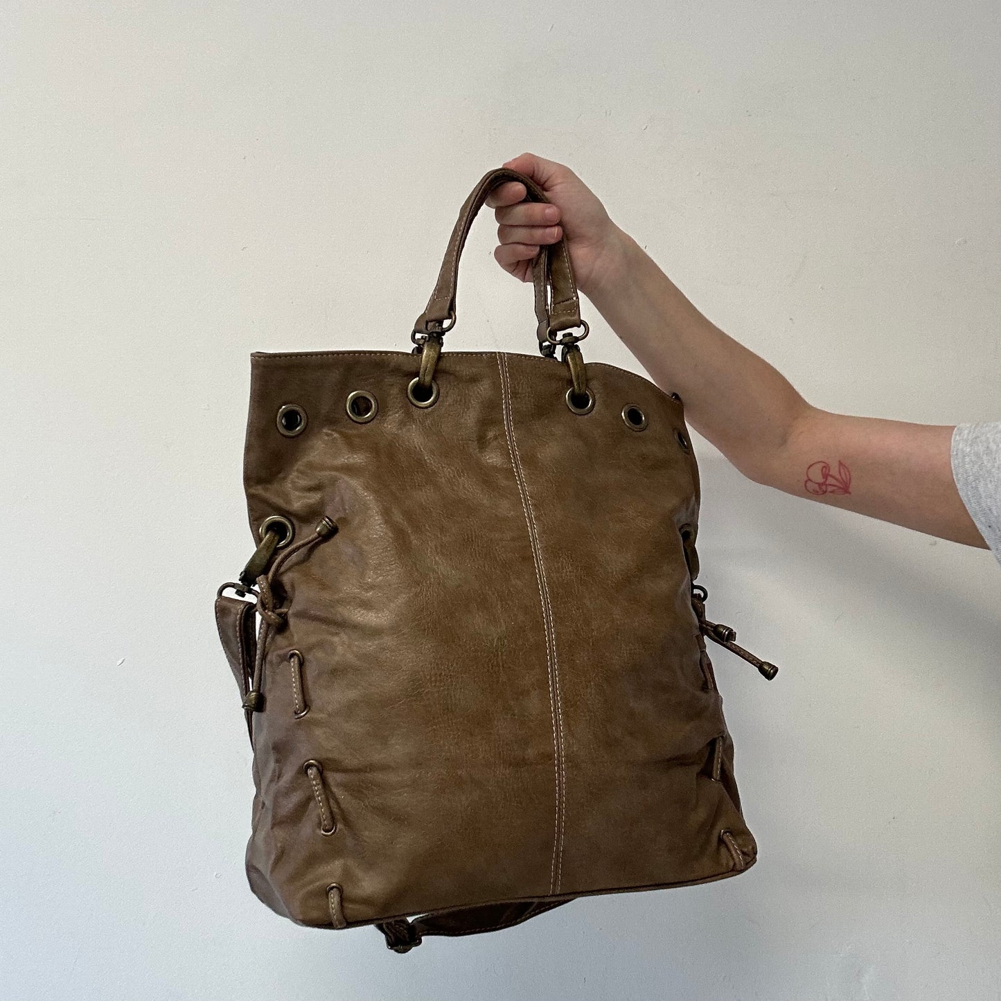 brown eyelet ruched sides faux leather shoulder bag
