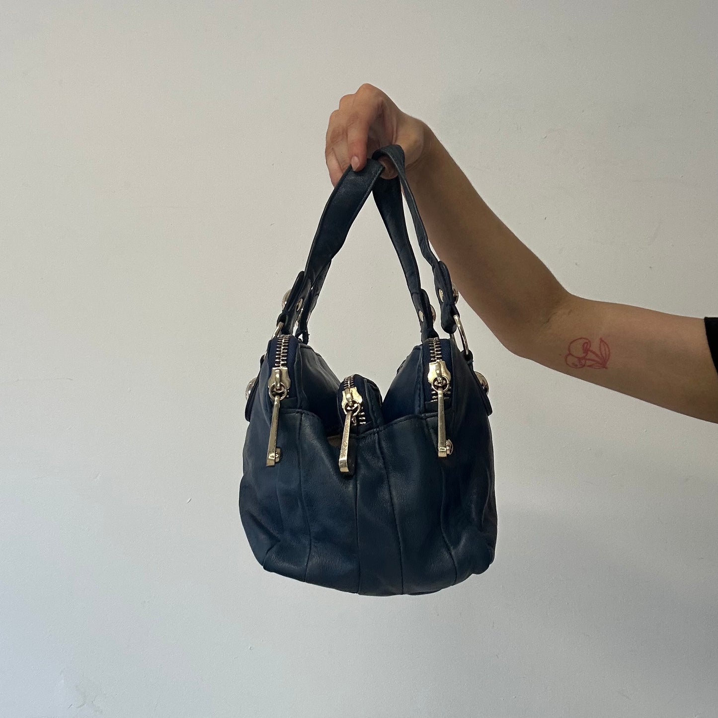 navy blue genuine leather triple compartment hand bag