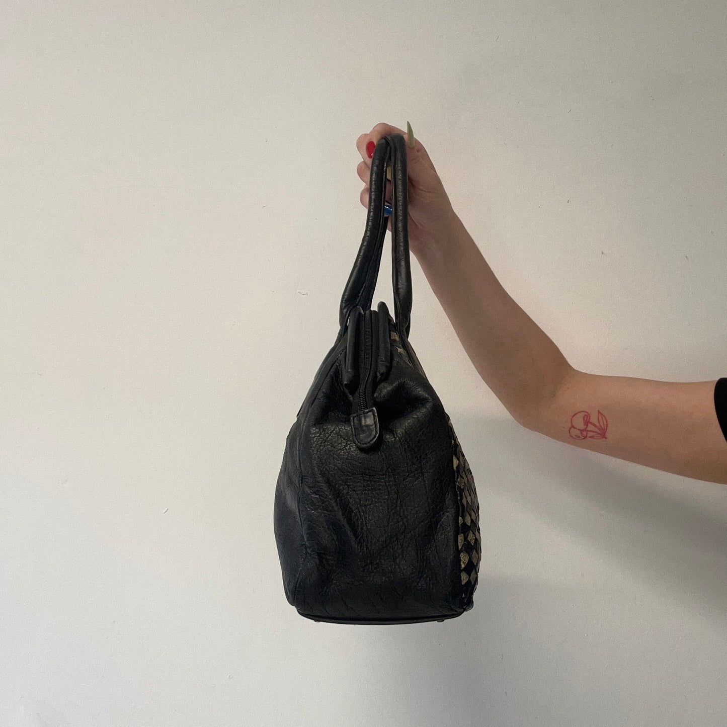 black and tanned woven leather shoulder bag