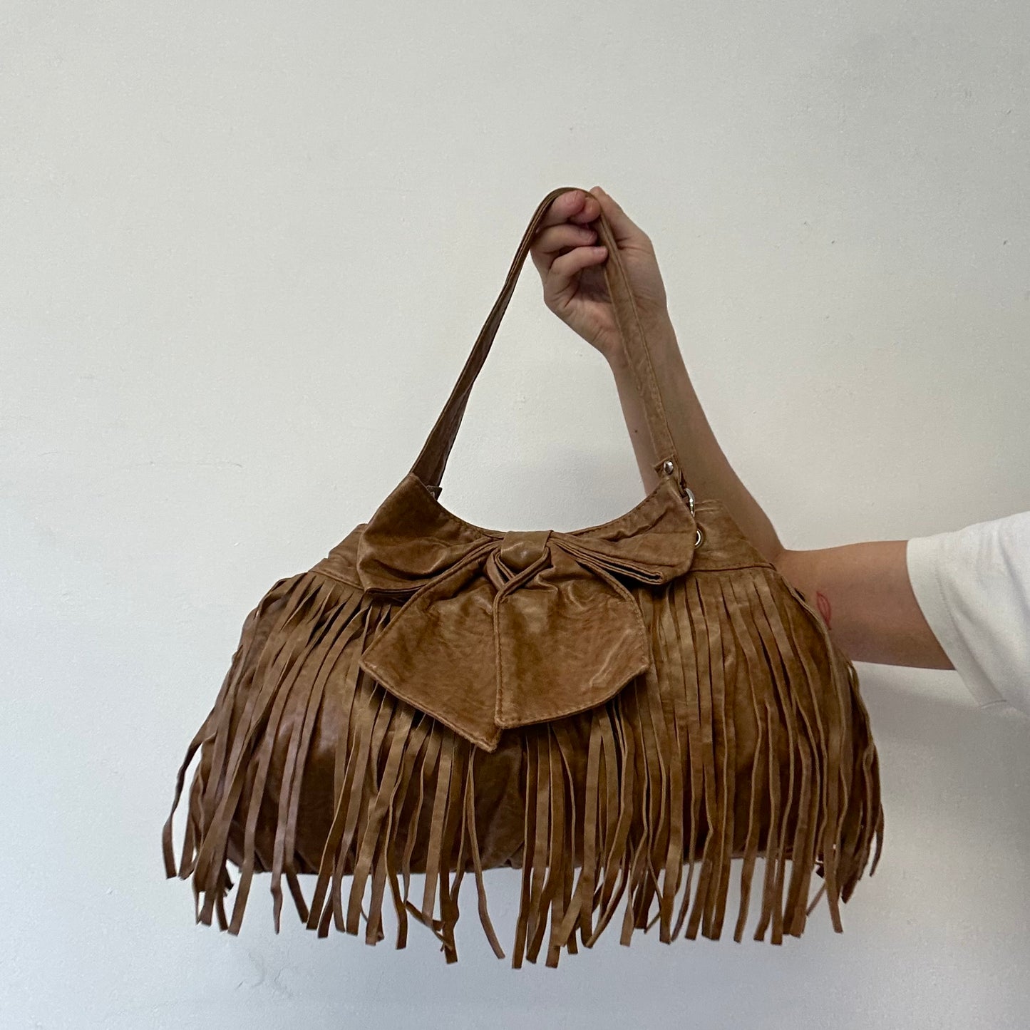 brown fringe oversized bow faux leather shoulder bag