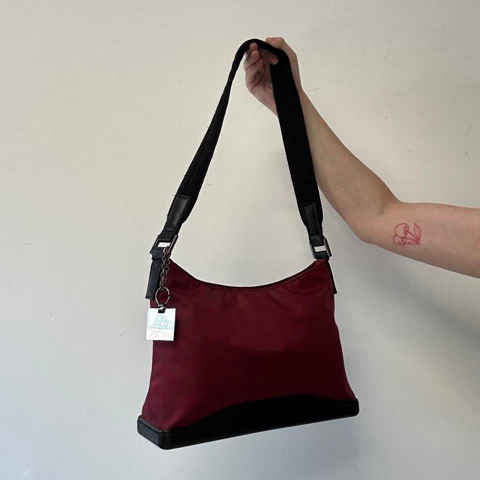 red and black canvas shoulder bag