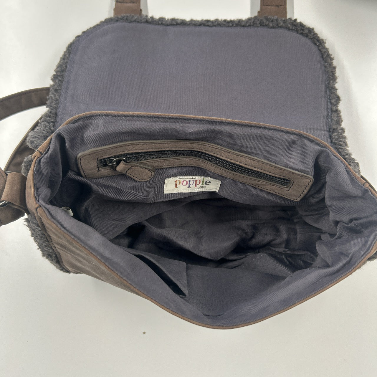 brown buckle shoulder bag with fleece trim