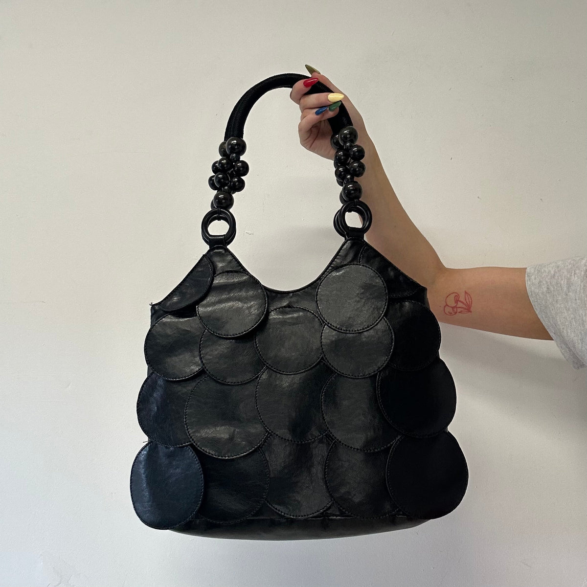 black faux leather disc beaded shoulder bag