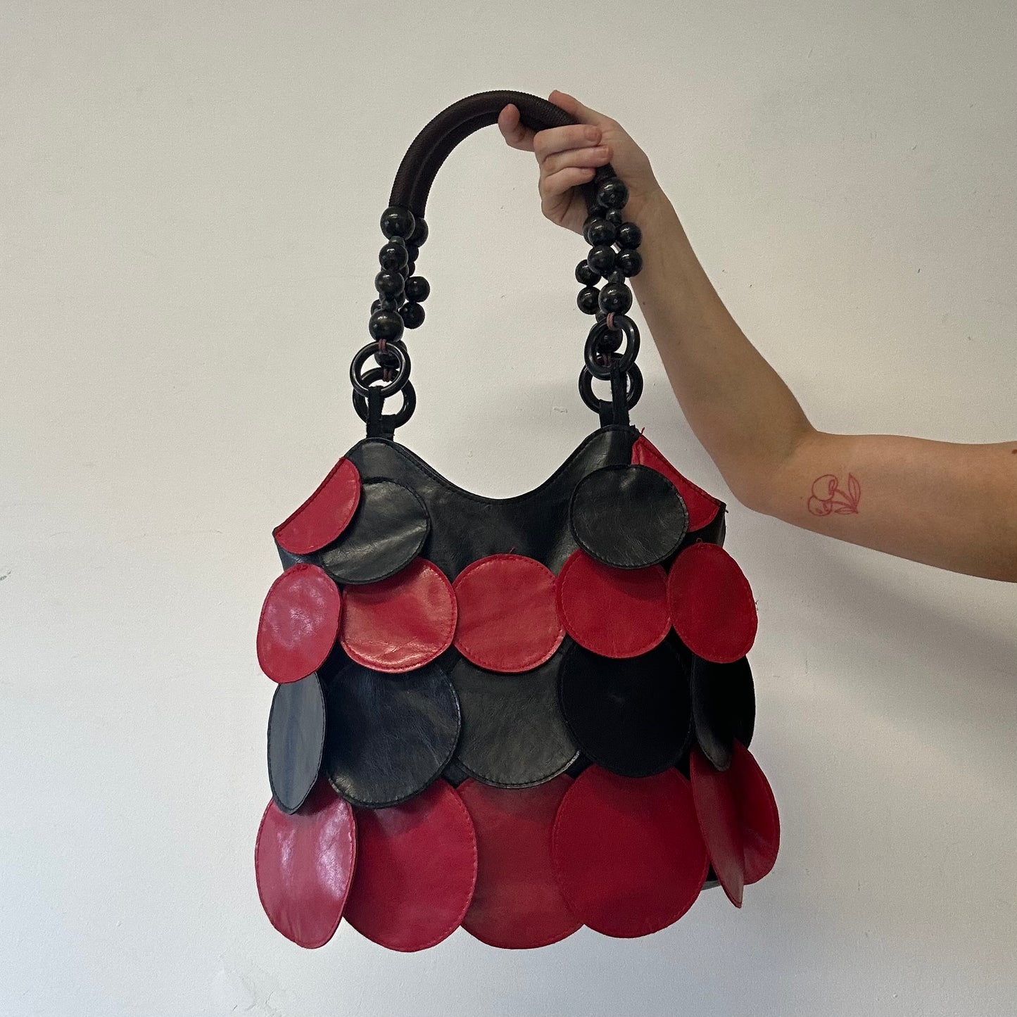 black and red faux leather disc beaded shoulder bag