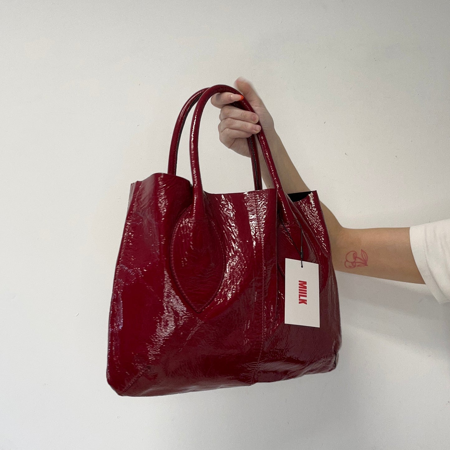 red lightweight patent shoulder bag