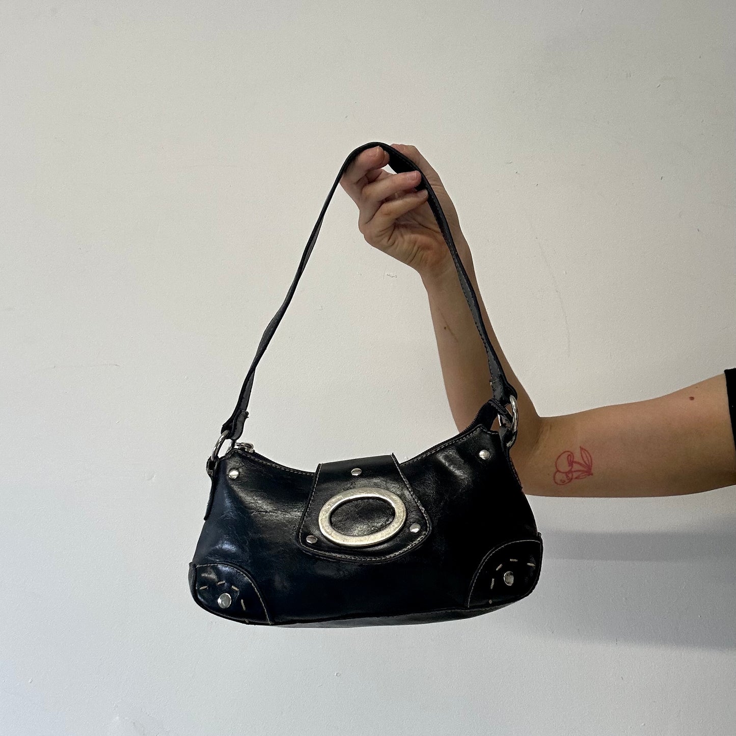 black faux leather oversized buckle shoulder bag