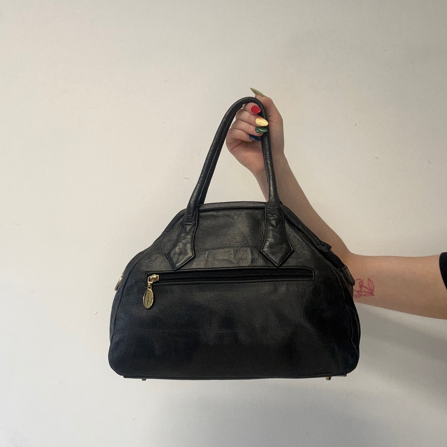 black and tanned woven leather shoulder bag