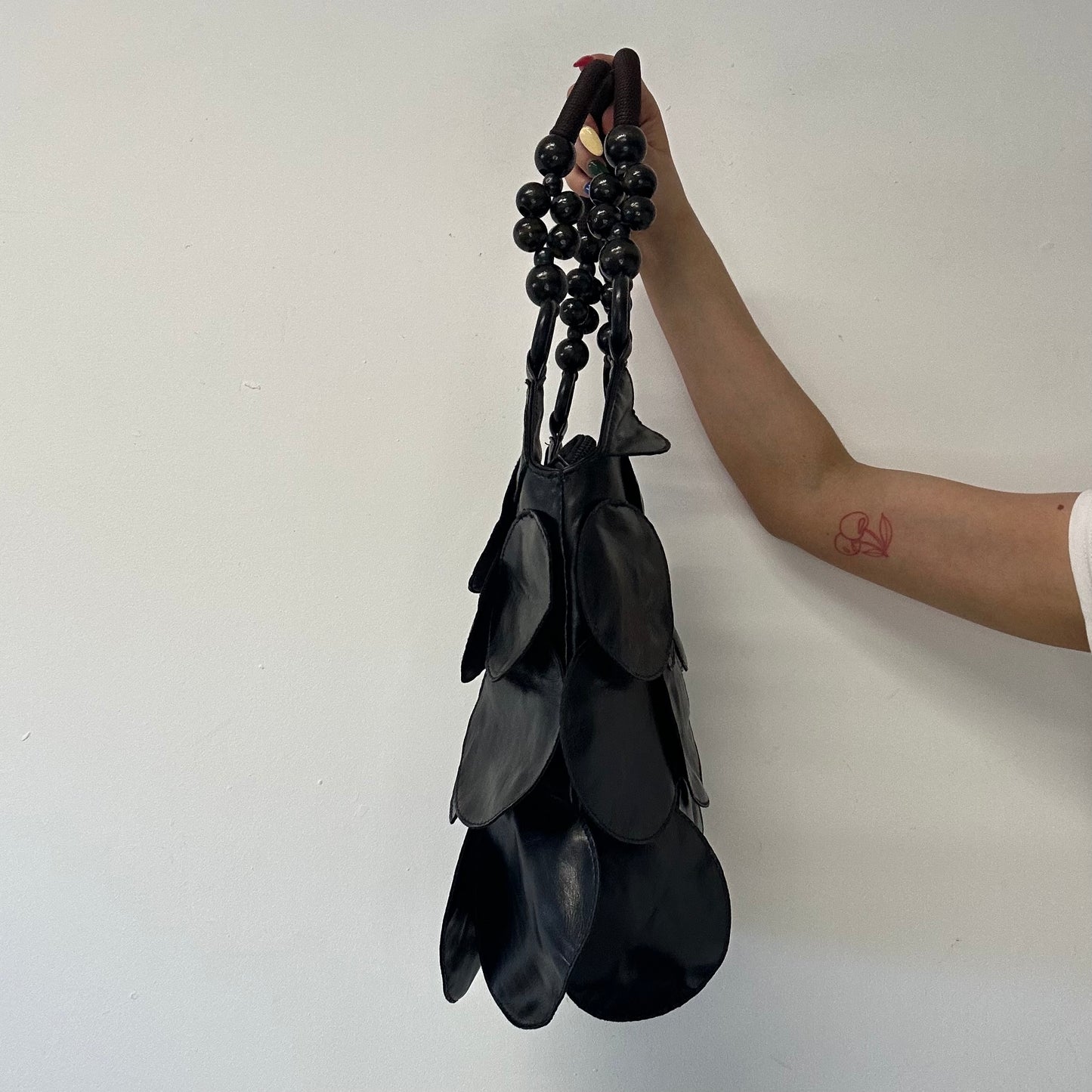 black faux leather disc beaded shoulder bag
