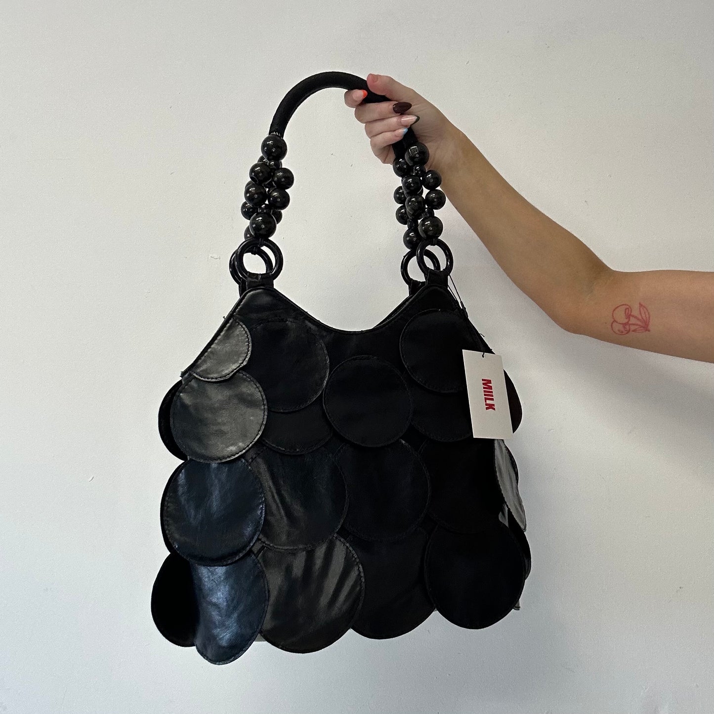 black faux leather disc beaded shoulder bag
