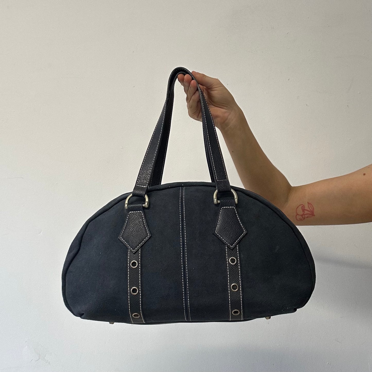 navy eyelet bowler shoulder bag