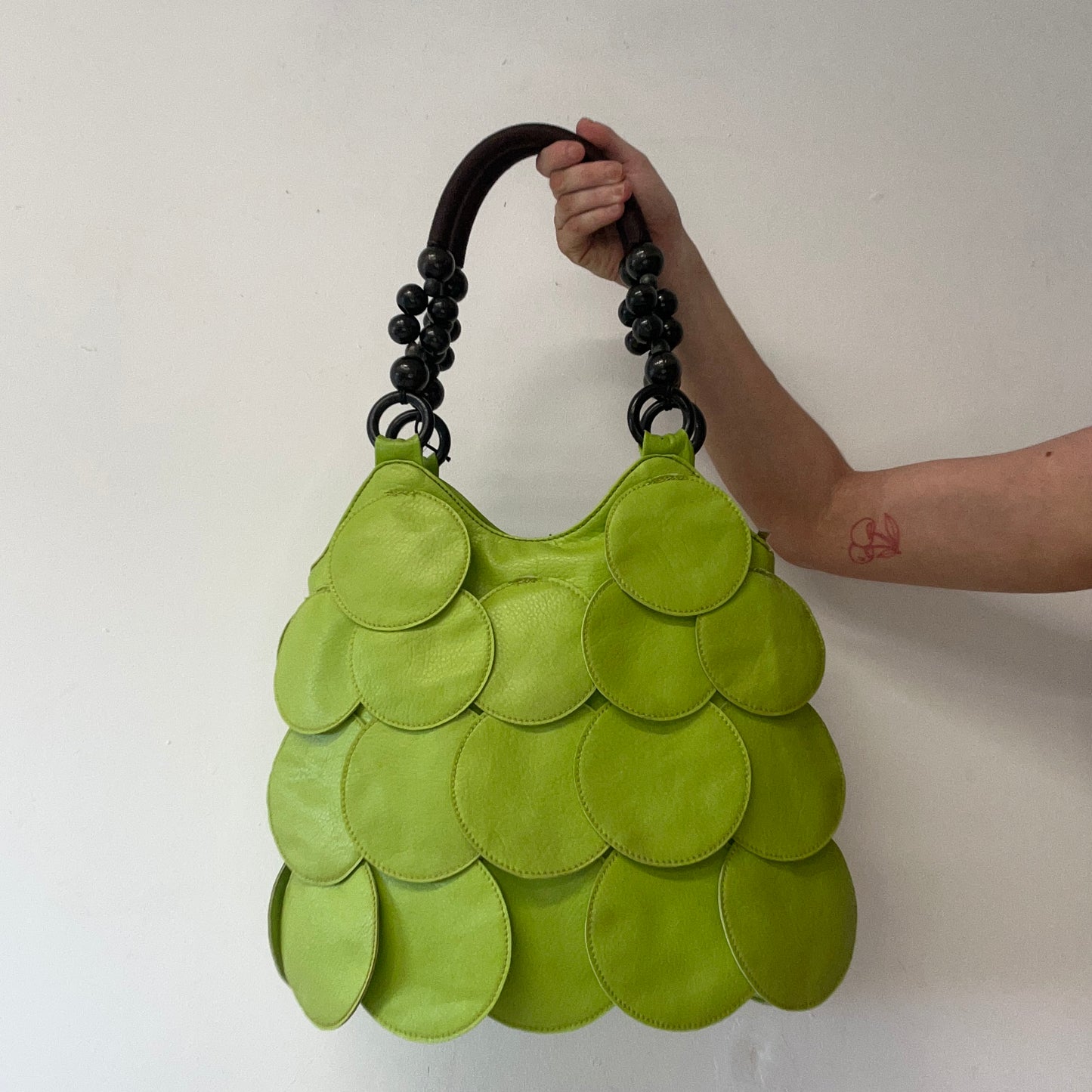 green faux leather disc beaded shoulder bag