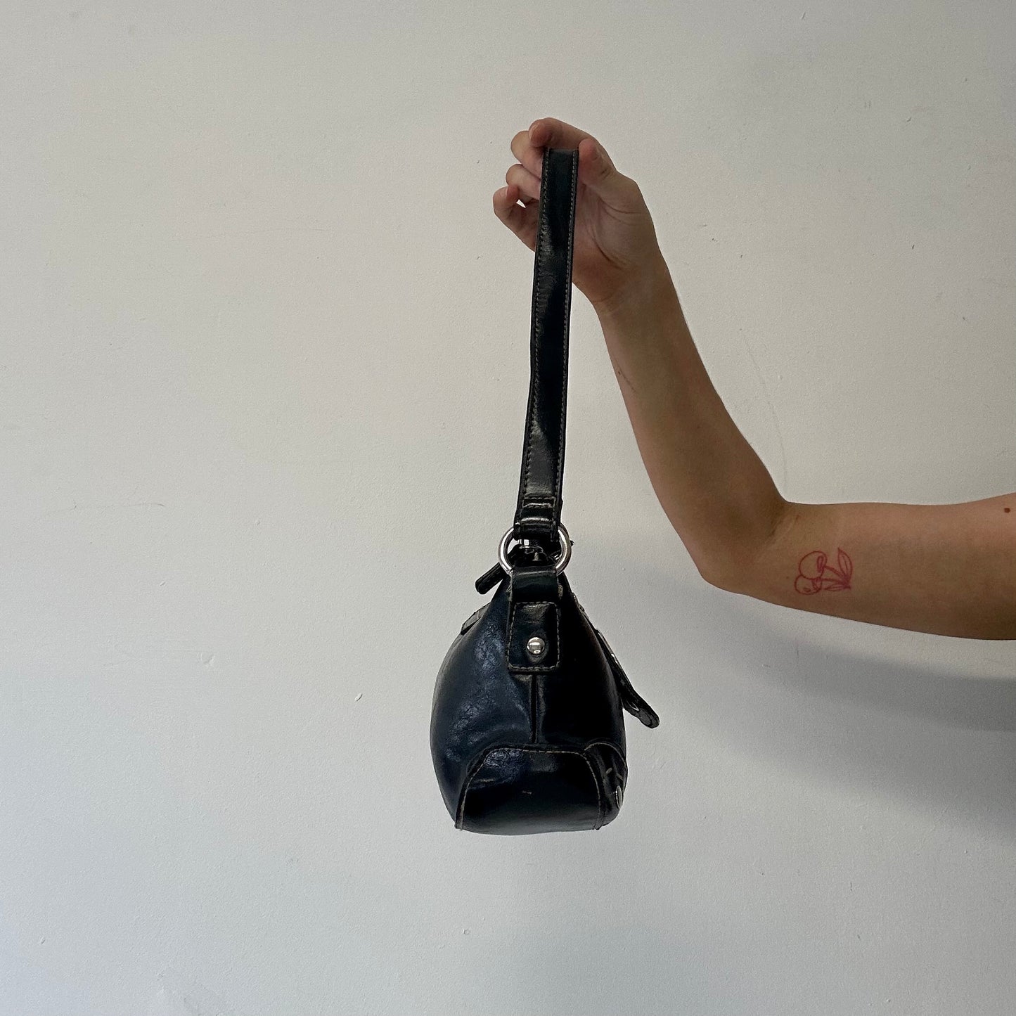 black faux leather oversized buckle shoulder bag