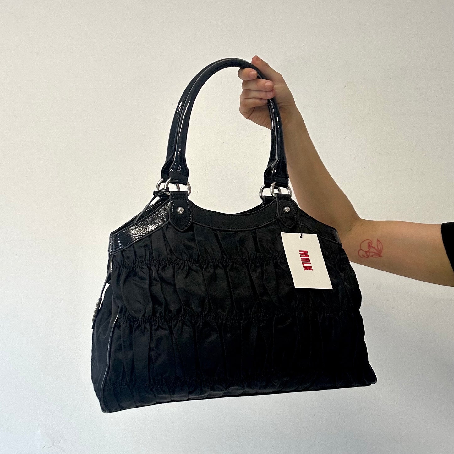 black ruched canvas and faux leather shoulder bag