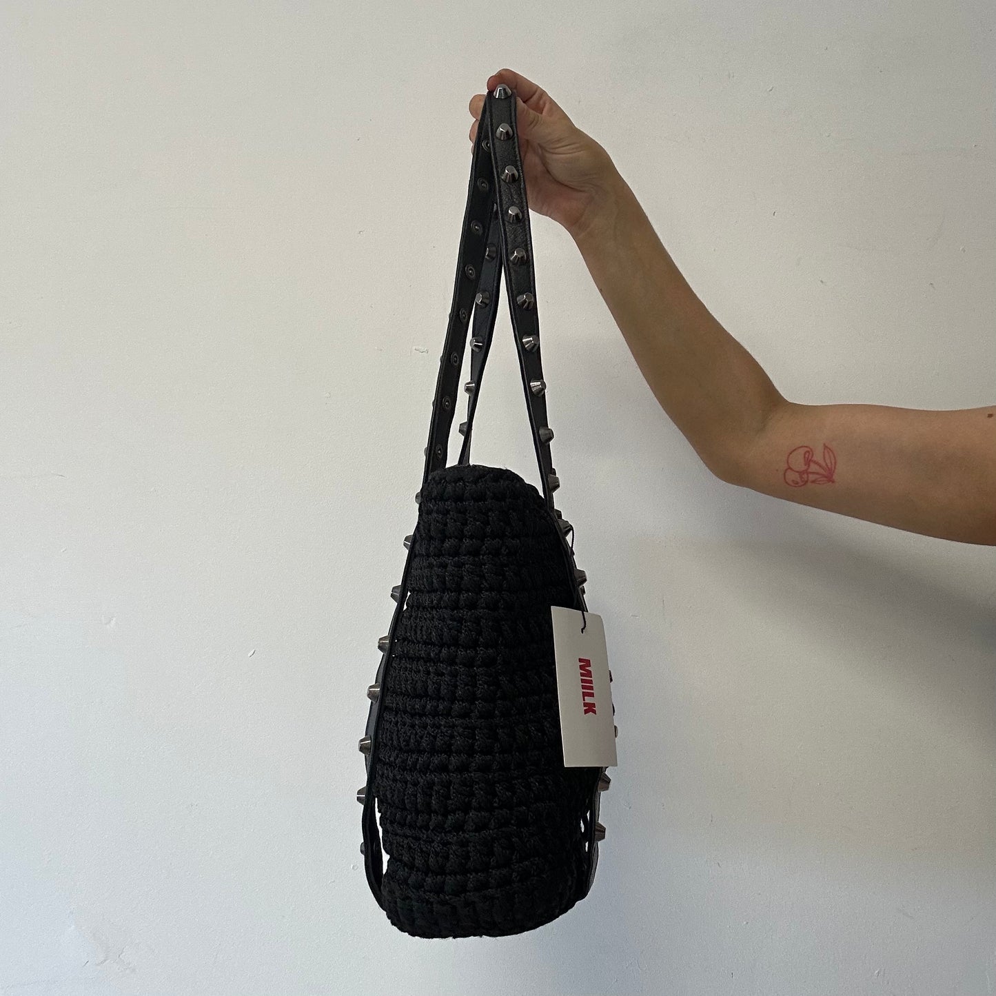 black studded genuine leather woven shoulder bag