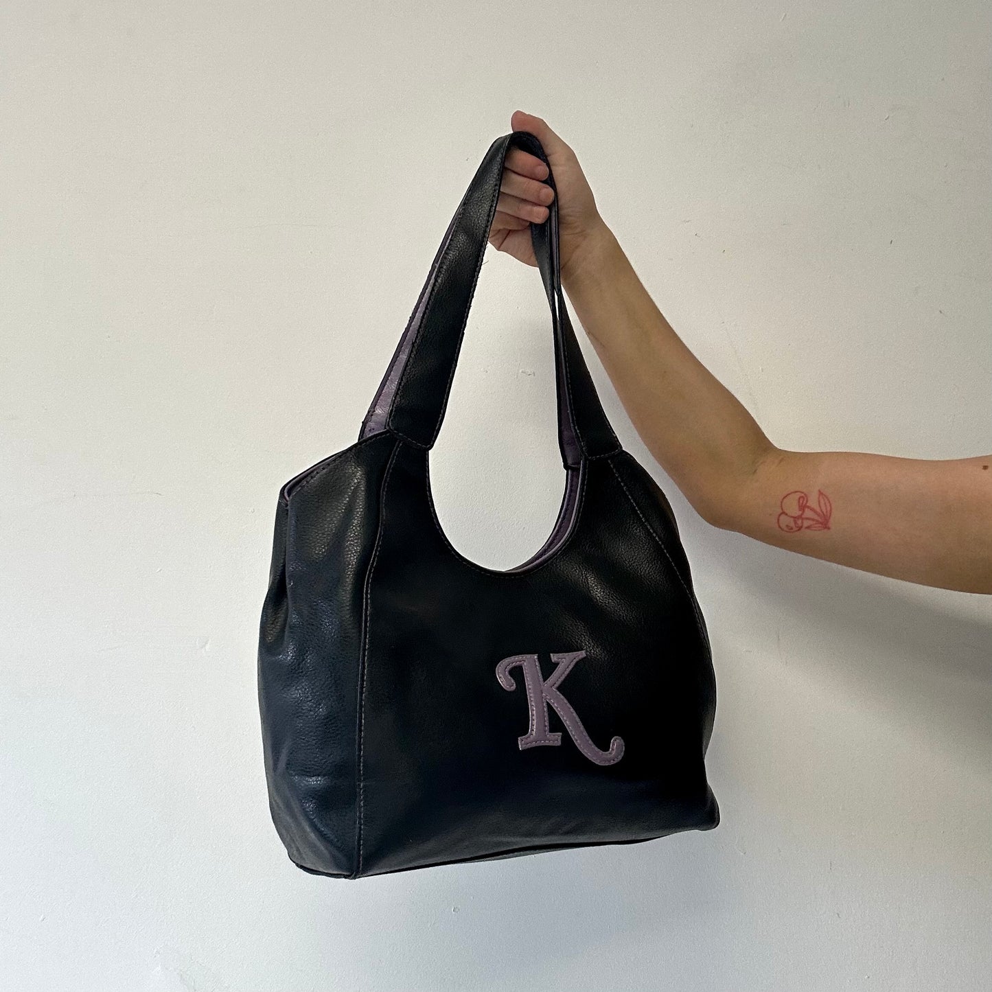 black and purple k faux leather shoulder bag