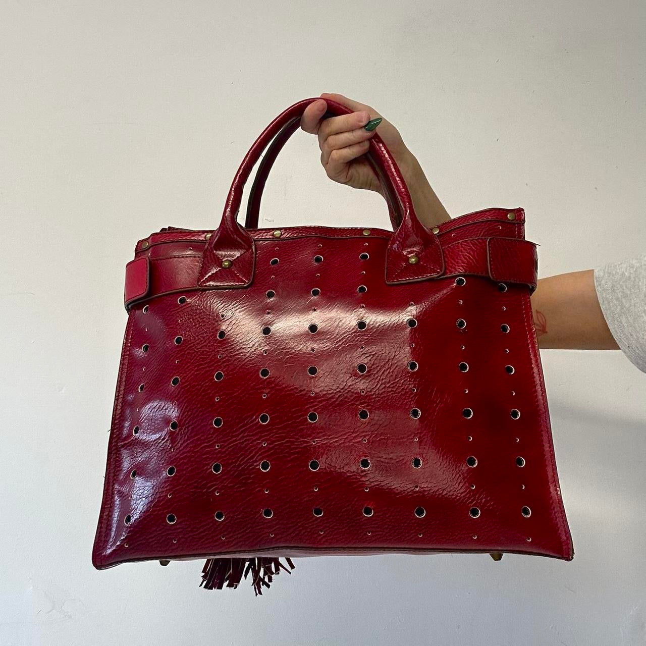 red faux leather studded buckle shoulder bag