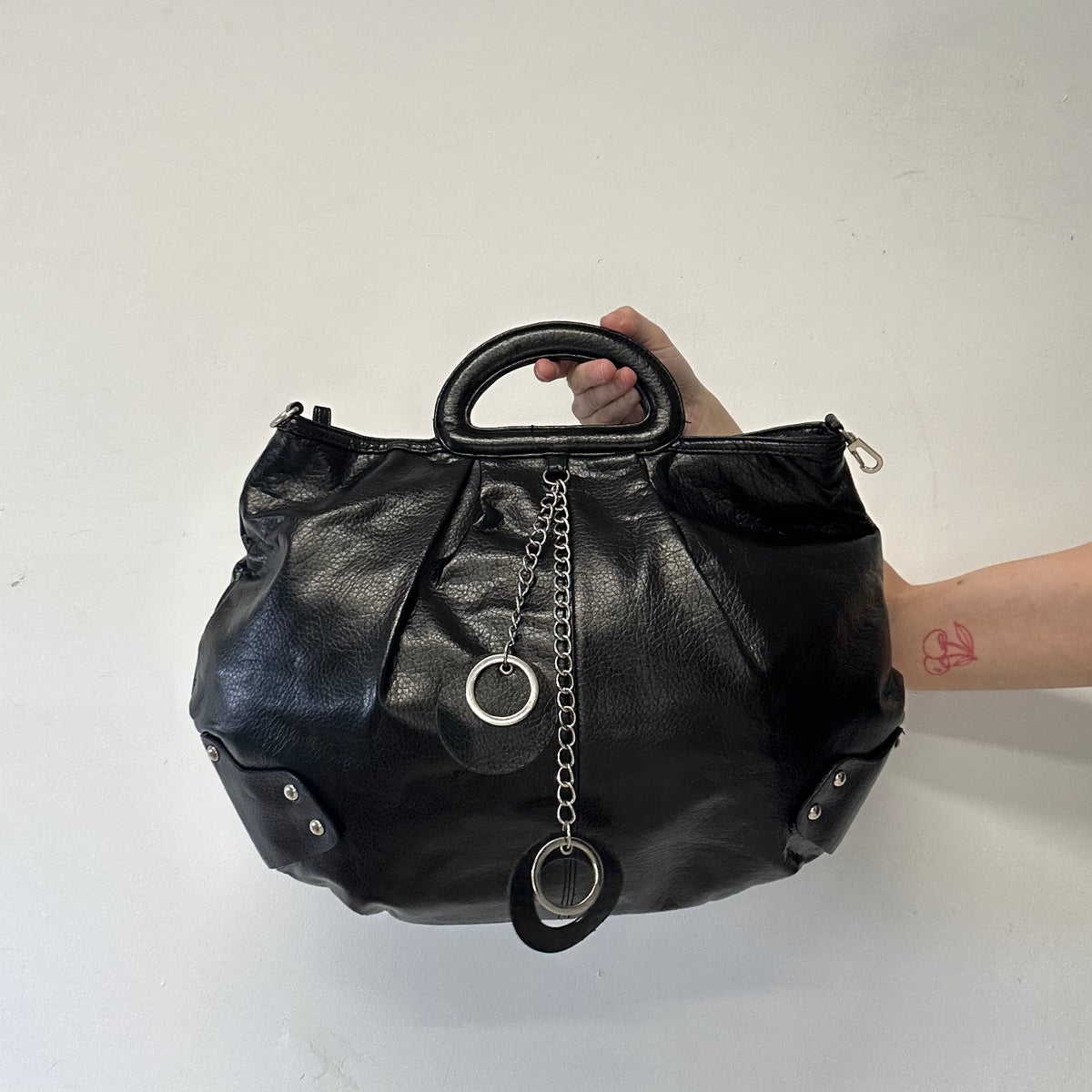 black faux leather keychain hand bag