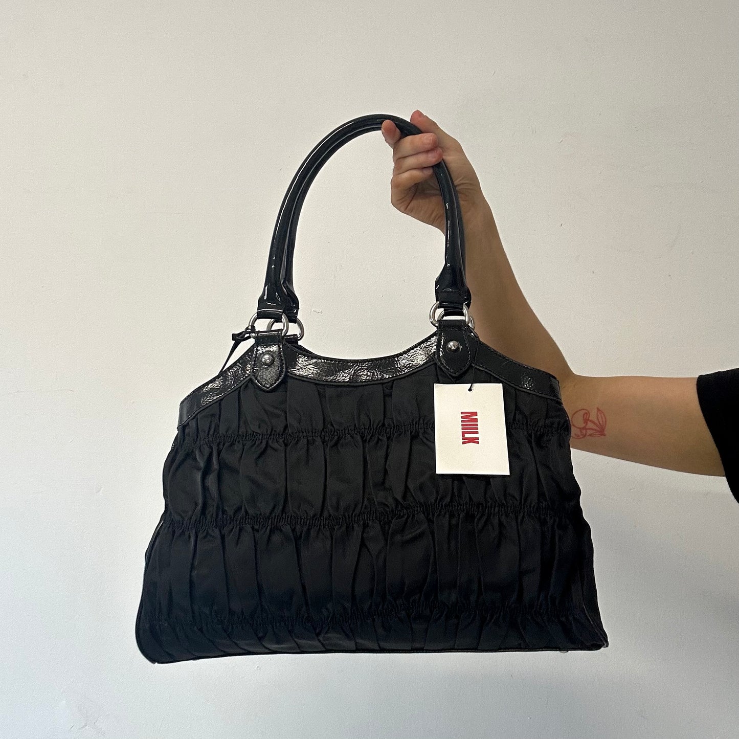 black ruched canvas and faux leather shoulder bag