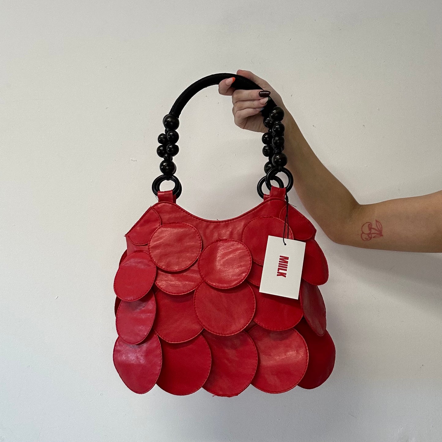 red faux leather disc beaded shoulder bag