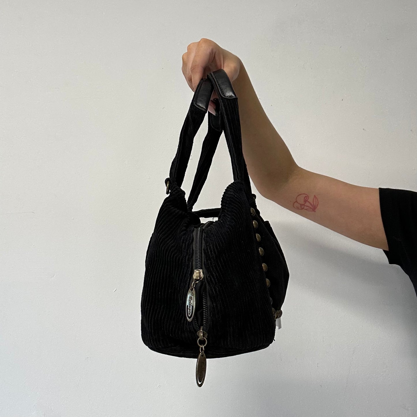 black corduroy studded shoulder bag