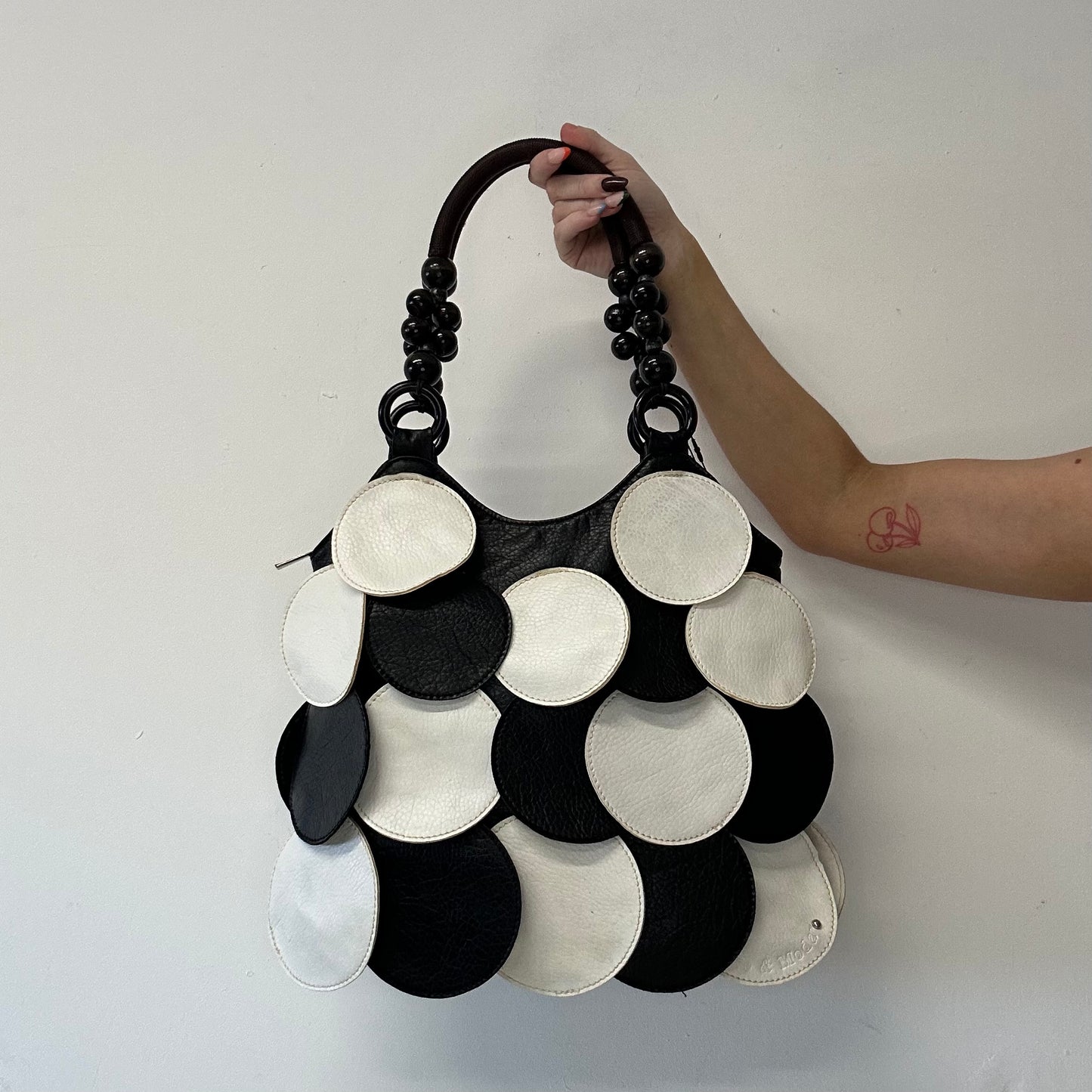 black and white faux leather disc beaded shoulder bag