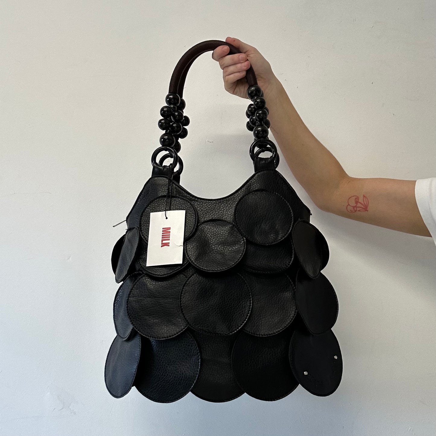 black faux leather disc beaded shoulder bag