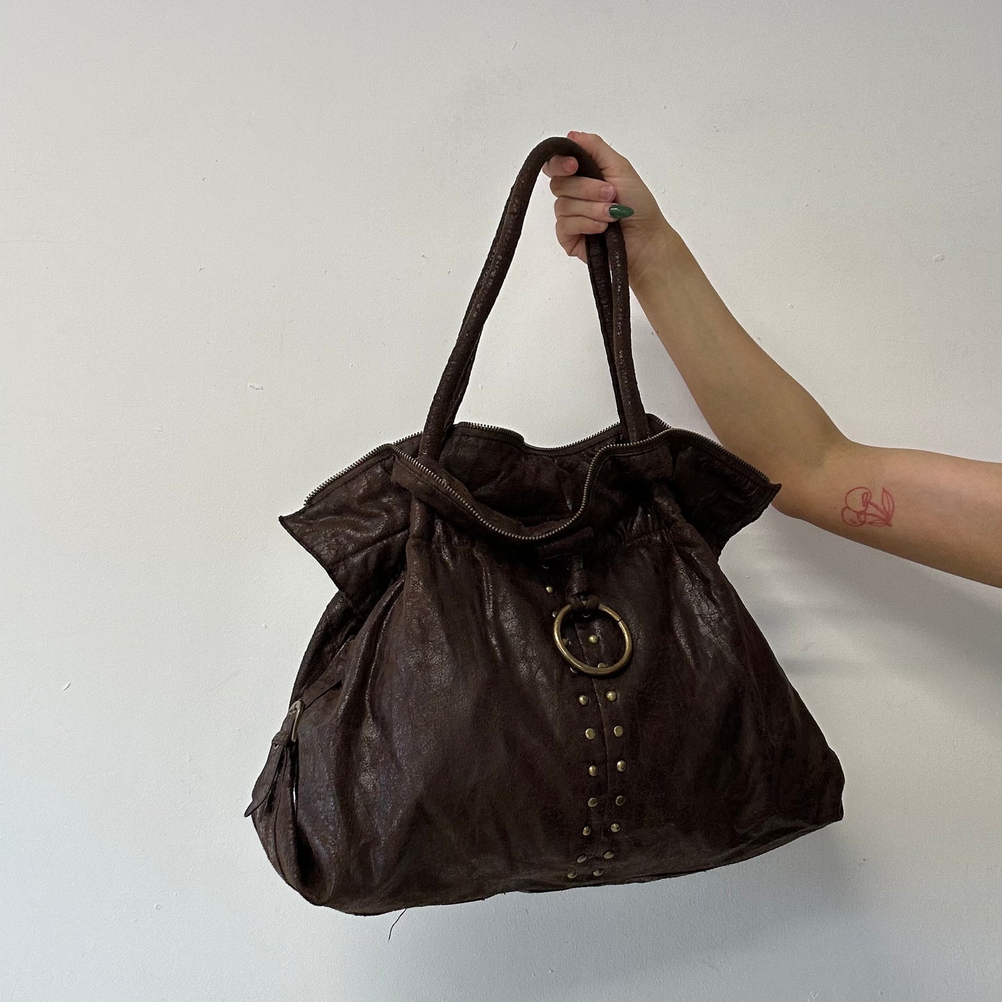 brown studded faux leather slouchy  shoulder bag