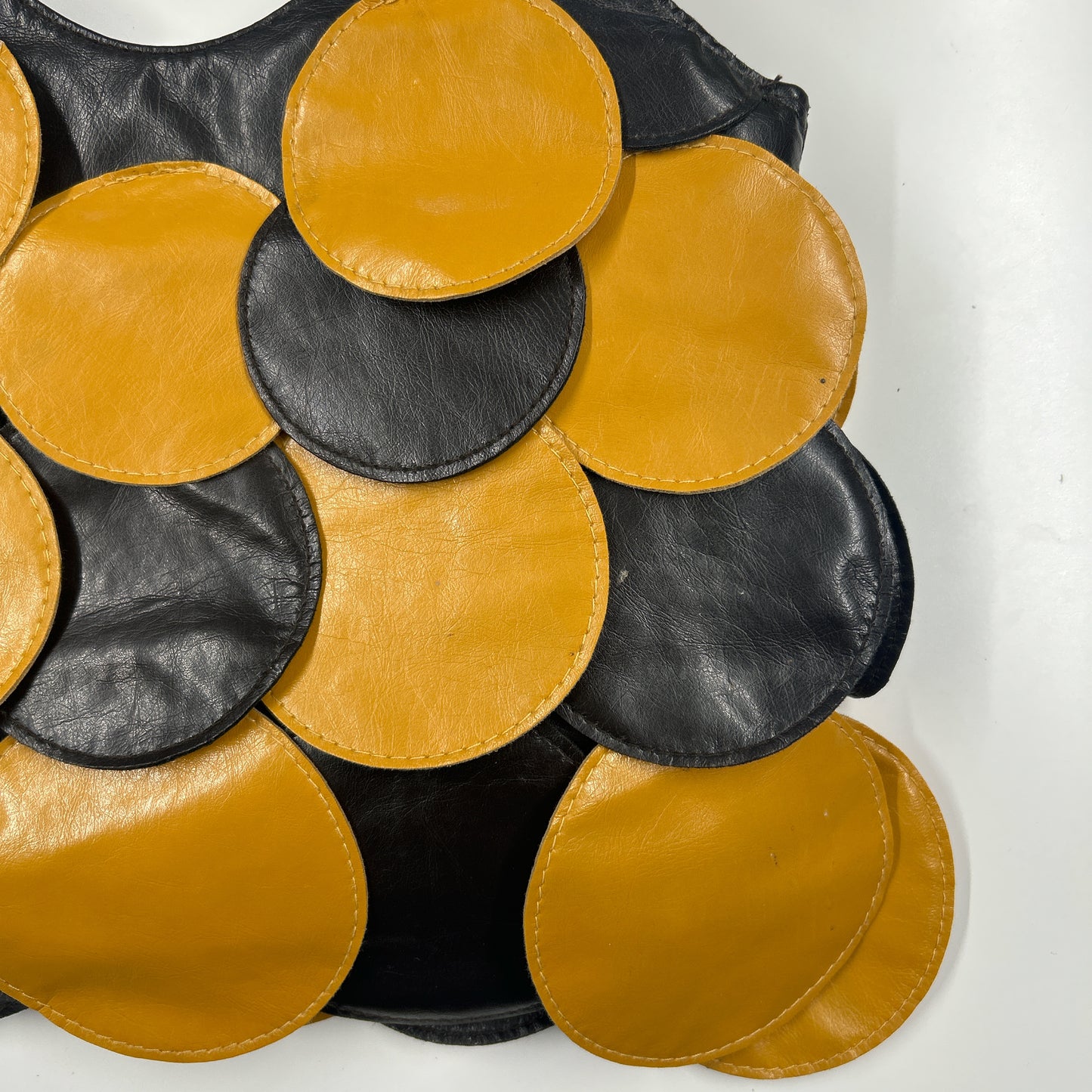 yellow and black faux leather disc beaded shoulder bag