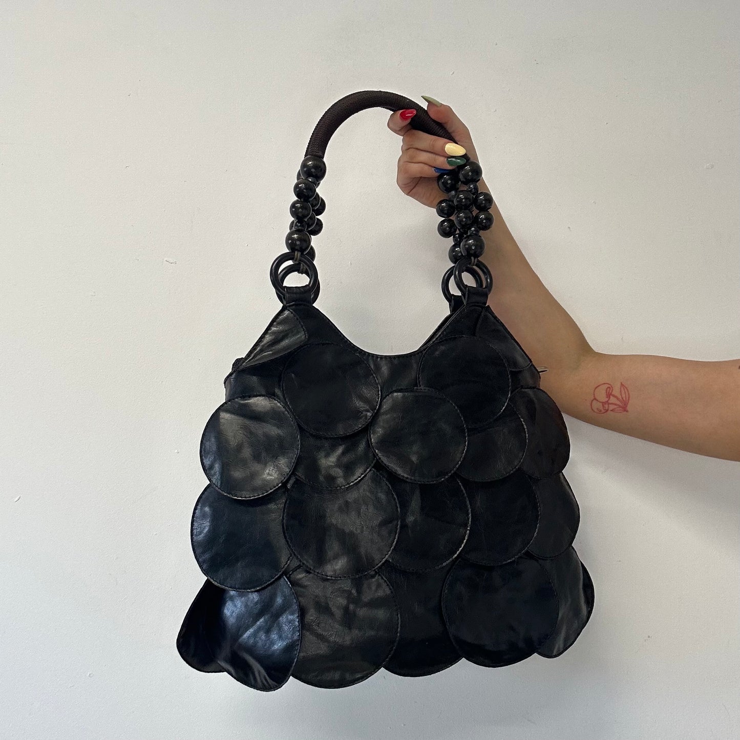 black faux leather disc beaded shoulder bag