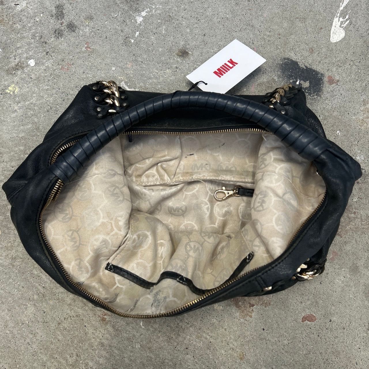 black genuine leather studded half crescent shoulder bag