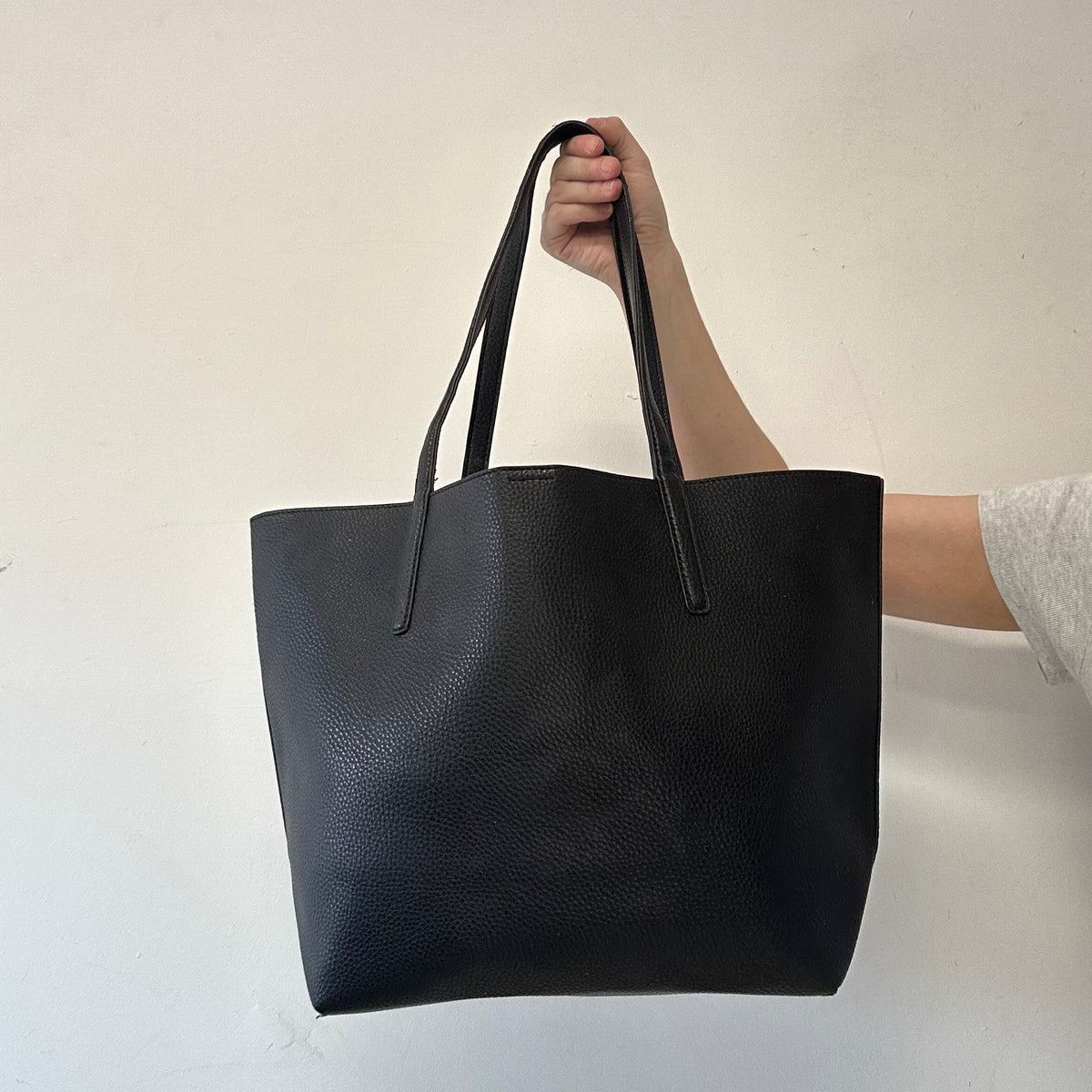 black Calvin Klein faux leather shoulder bag