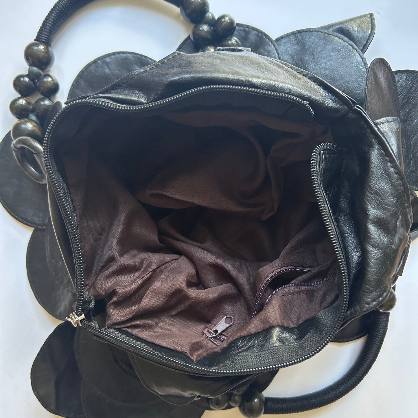black faux leather disc beaded shoulder bag