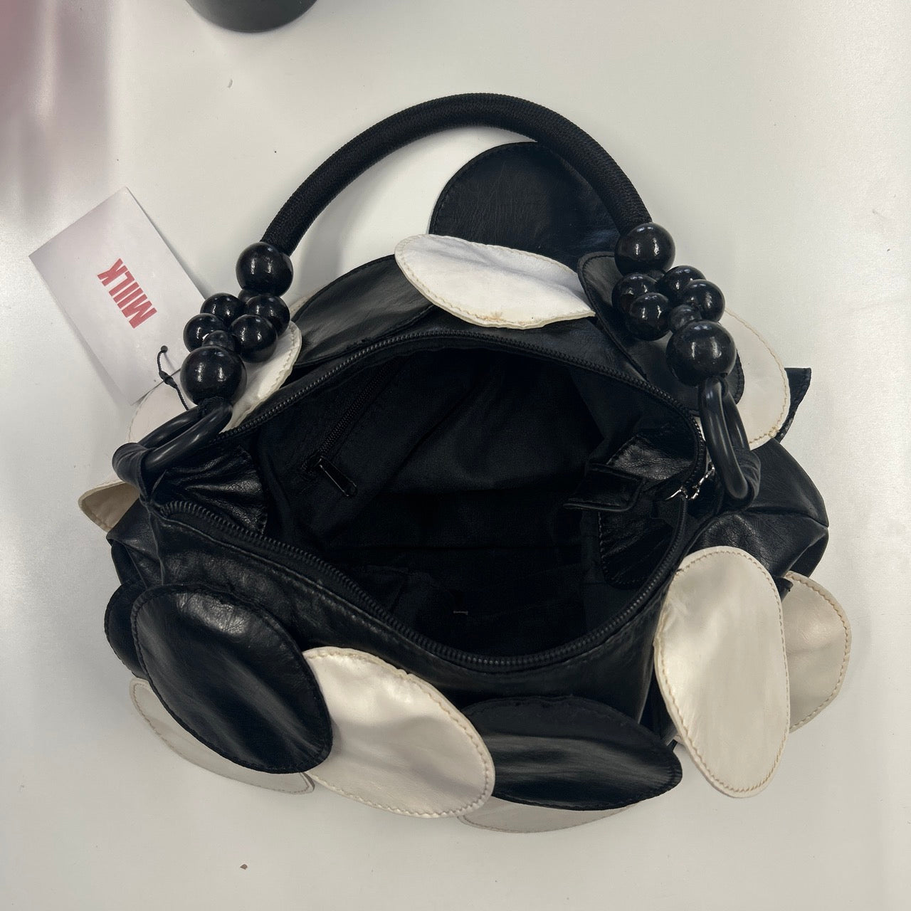 black and white faux leather disc beaded shoulder bag