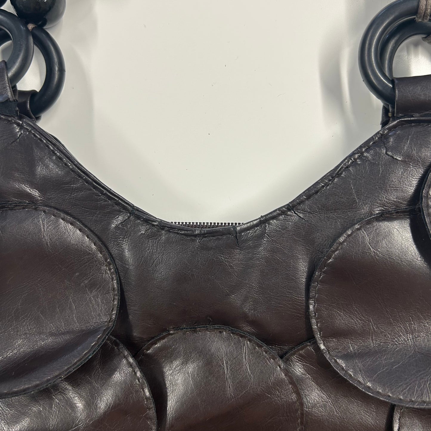 dark brown faux leather disc beaded shoulder bag