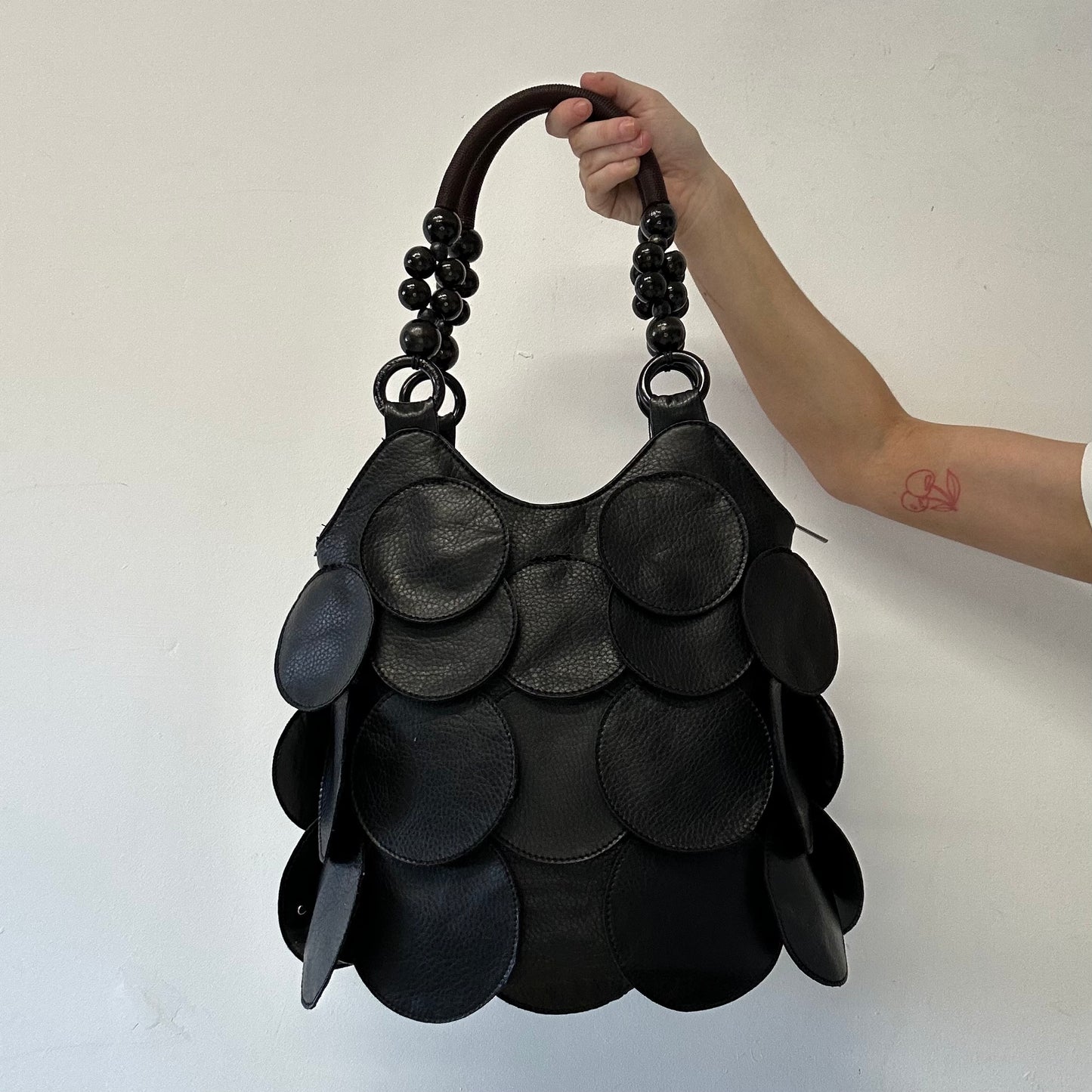 black faux leather disc beaded shoulder bag